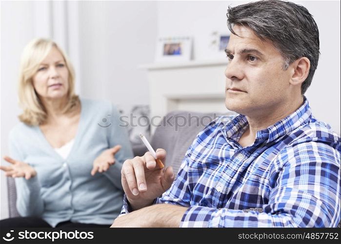 Mature Couple Arguing Over Smoking At Home