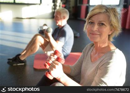 mature couple doing fitness exercises