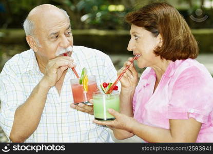 Mature couple drinking juice