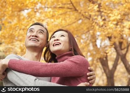 Mature Couple Embracing in Park