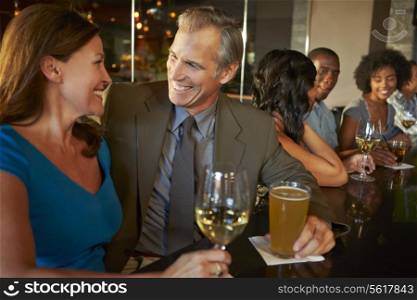 Mature Couple Enjoying Drink In Bar Together