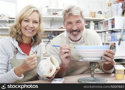 Mature Couple Enjoying Pottery Class Together