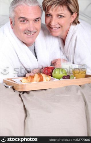 Mature couple having breakfast