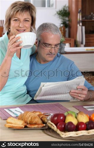 Mature couple having breakfast