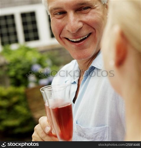 Mature couple holding champagne flutes
