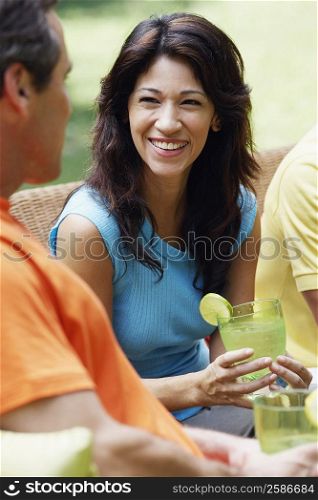 Mature couple holding glasses of lemonade