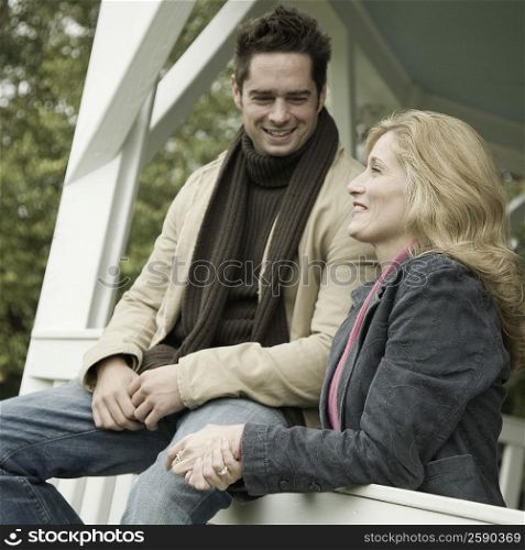 Mature couple in a porch and smiling