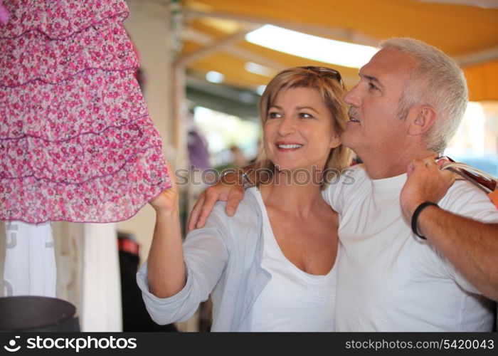 Mature couple in clothing store