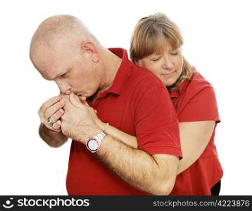 Mature couple in love. She&rsquo;s hugging him and he&rsquo;s kissing her. Isolated on white.