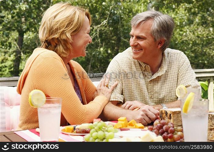 Mature couple looking at each other at the table
