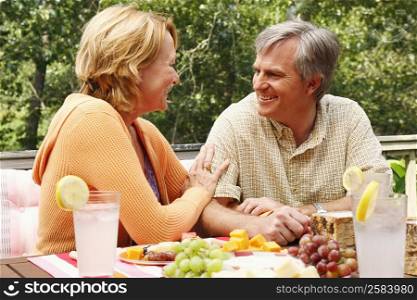 Mature couple looking at each other at the table