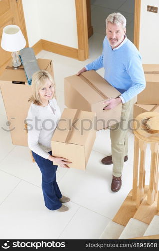 Mature Couple Moving In To New Home