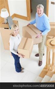 Mature Couple Moving In To New Home