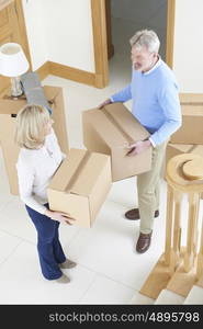 Mature Couple Moving In To New Home