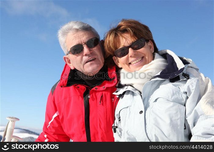 Mature couple on a skiing holiday