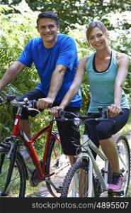 Mature Couple On Cycle Ride In Countryside