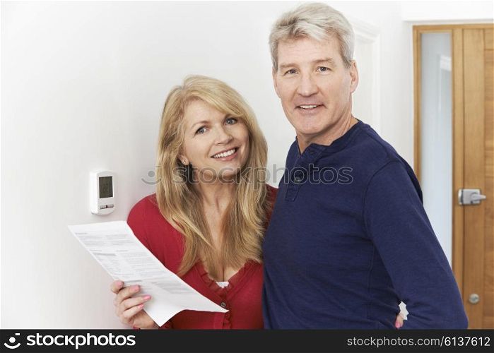 Mature Couple Saving Money On Domestic Heating Bills