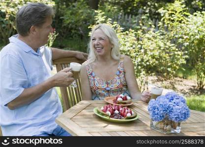 Mature couple sitting at the breakfast table