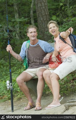 Mature couple sitting on a bench at picnic