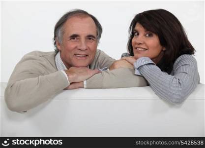 mature couple sitting on the couch