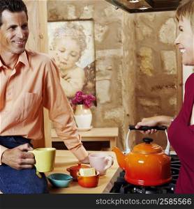 Mature couple smiling in the kitchen
