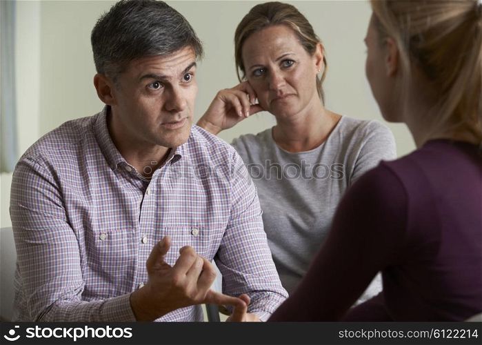 Mature Couple Talking With Counsellor
