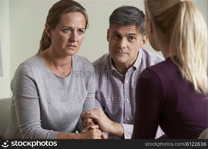 Mature Couple Talking With Counsellor