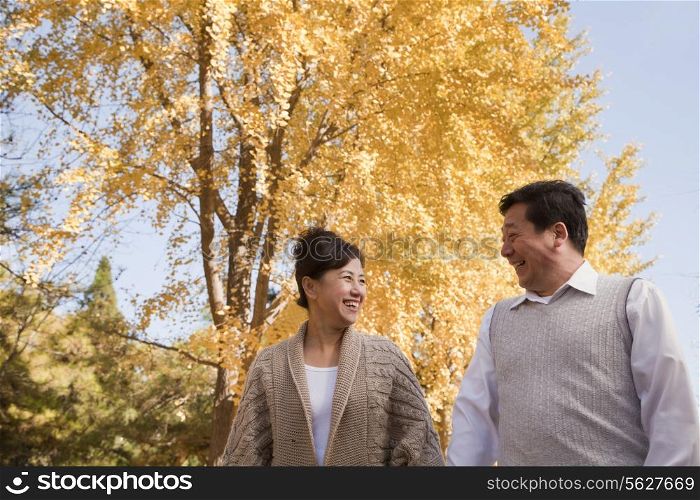 Mature Couple Walking in the Park