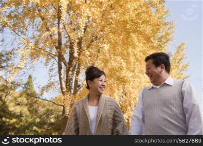 Mature Couple Walking in the Park
