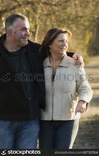 Mature couple walking together and smiling