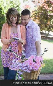Mature couple watching photographs in a digital camera