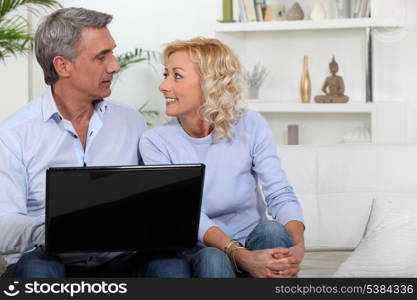 Mature couple with computer