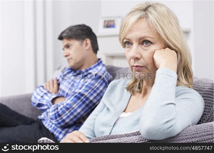 Mature Couple With Relationship Difficulties Sitting On Sofa