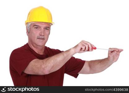 mature craftsman using screwdriver