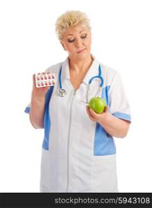 Mature doctor with apple and pills isolated