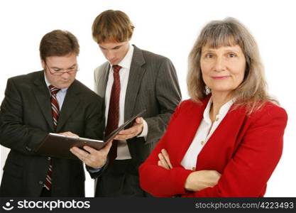 Mature female business executive with her team. Isolated on white.