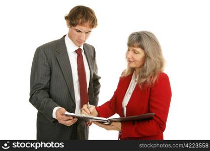 Mature female mentor and young male employee discussing business reports. Isolated on white.