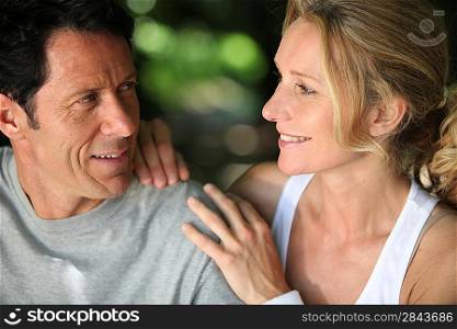 Mature fit couple exercising together in the countryside