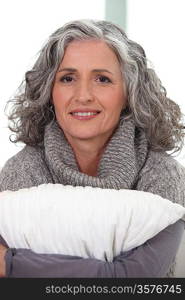 mature grey-haired woman smiling