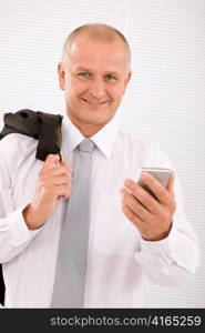 Mature handsome businessman wear suit with phone jacket over shoulder