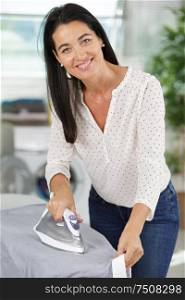 mature lady ironing clothes