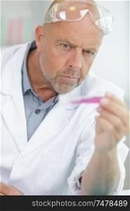 mature male doctor looking confused