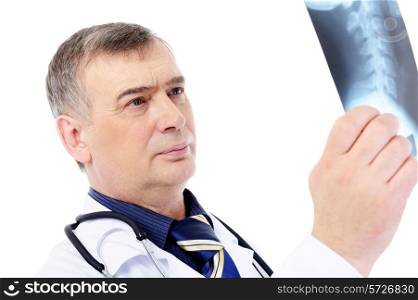 mature male doctor looking on the X-ray - isolated on white