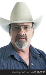 Mature male wearing a cowboy hat and eye glasses.. Old cowboy