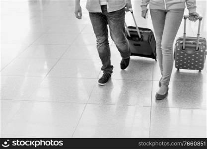 Mature man arriving with his daughter in airport looking for their pick up