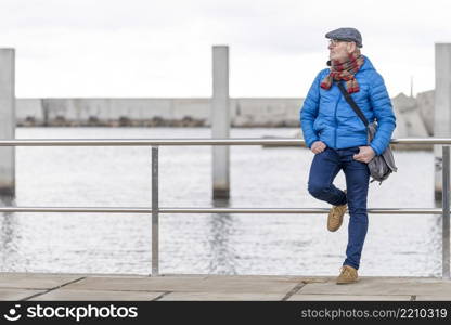 Mature man at the beach wearing casual clothes