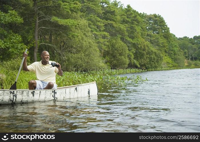Mature man canoeing in a lake