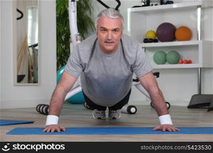 Mature man doing pushups