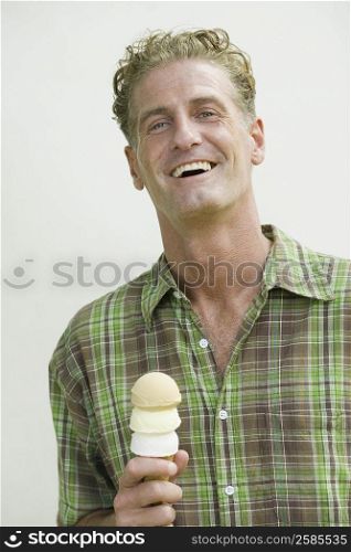 Mature man holding an ice cream cone