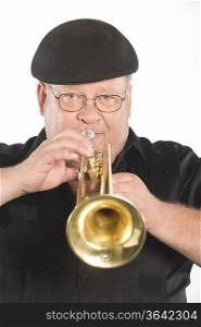 Mature man in flat cap playing the trumpet